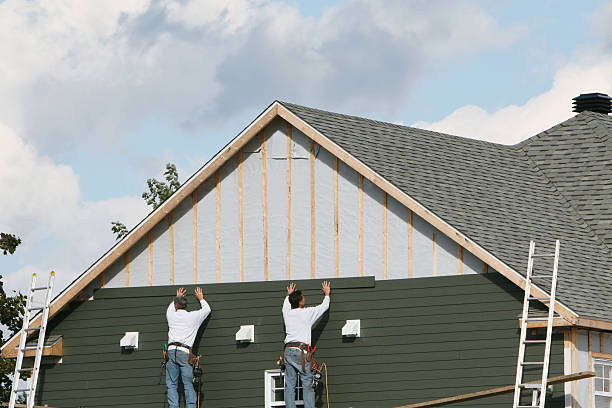 Professional Storm Damage Siding Repair technician working in Lykens, PA